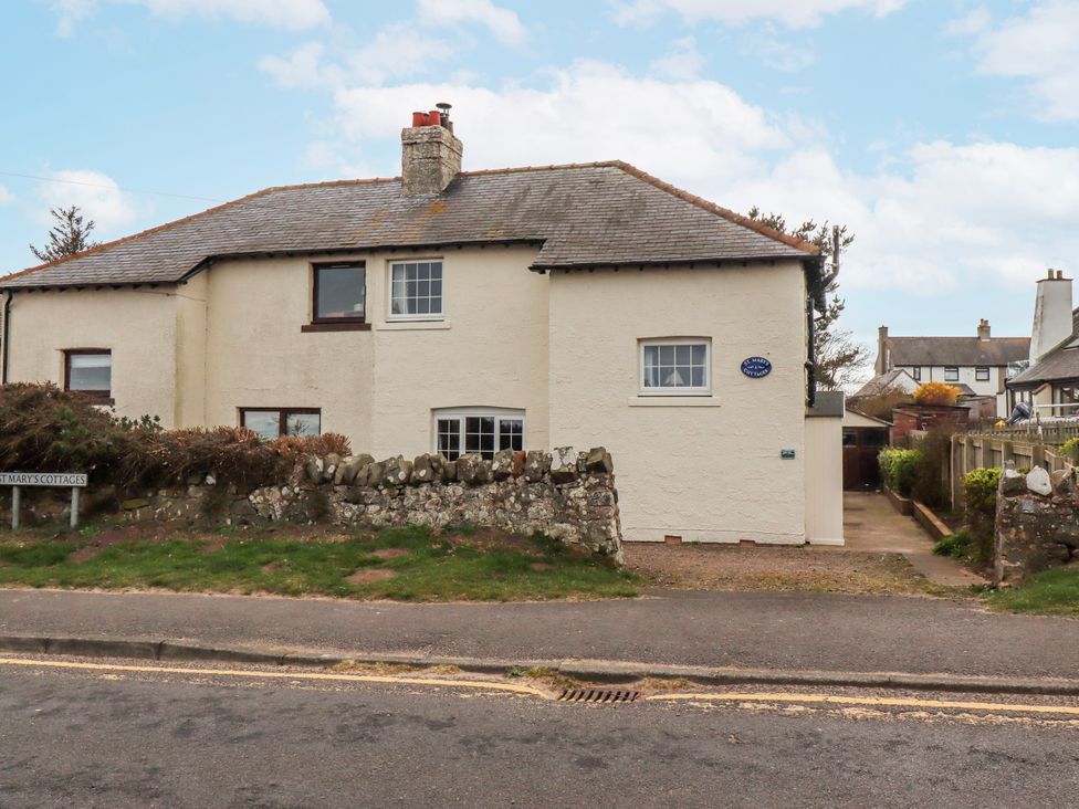 A cottage with windows and a door at St Marys Cottages No4 Low Newton-by-the-Sea