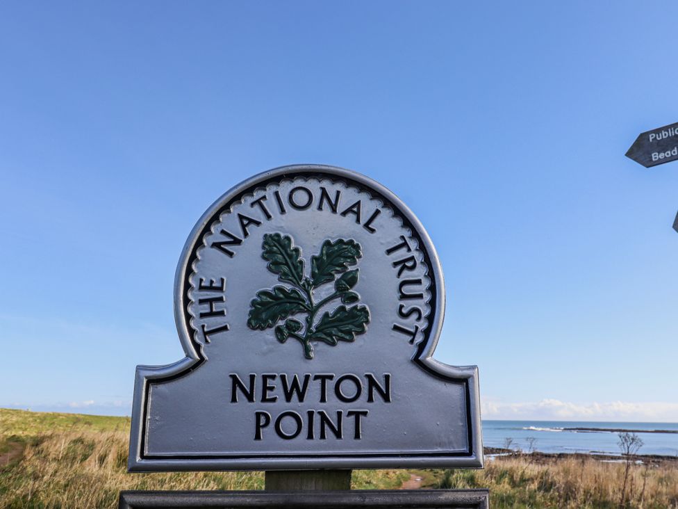 A sign for The National Trust at Newton Point in Low Newton-by-the-Sea