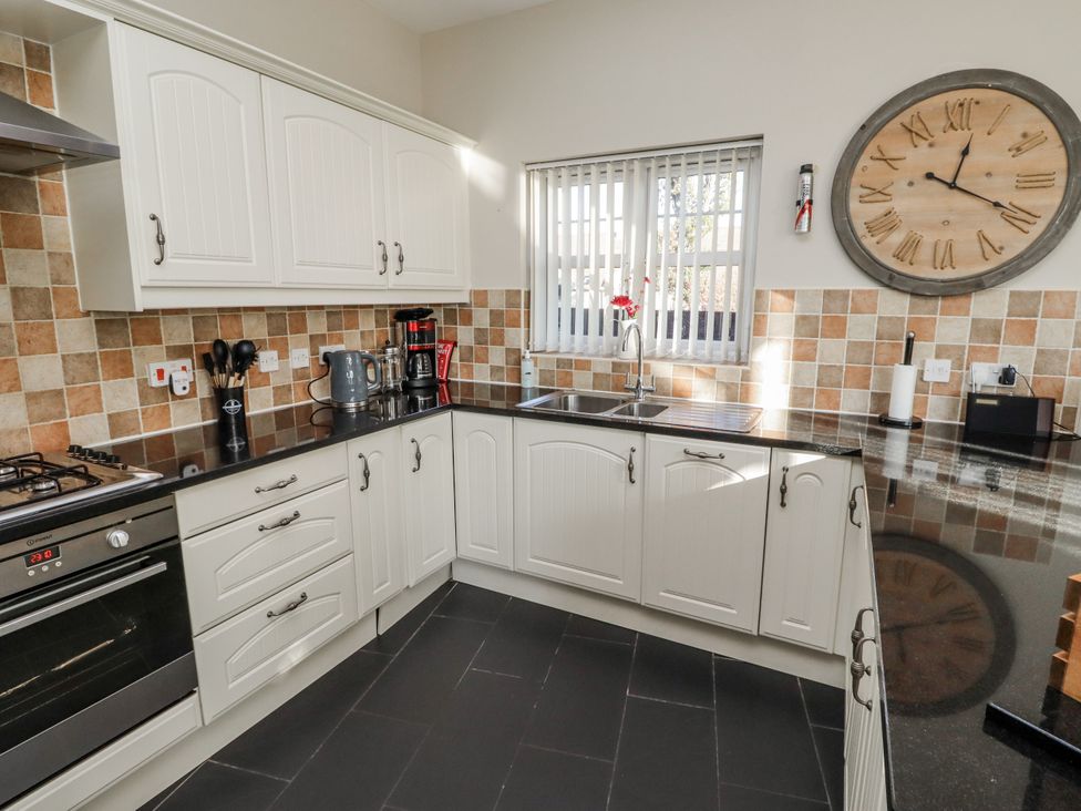 A kitchen with cabinets and appliances at Red Fox in Lucker