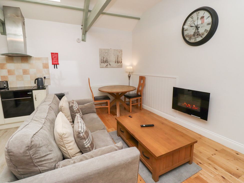 A living room with a sofa and coffee table at Chiff Chaff in Lucker