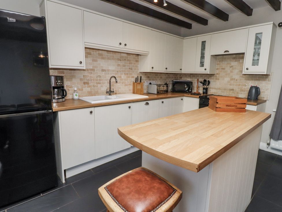 A kitchen with appliances and a countertop at Goldfinch in Lucker