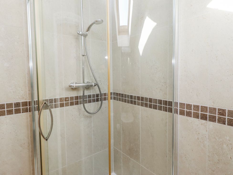 A shower with glass panels and tile in Goosander Bamburgh