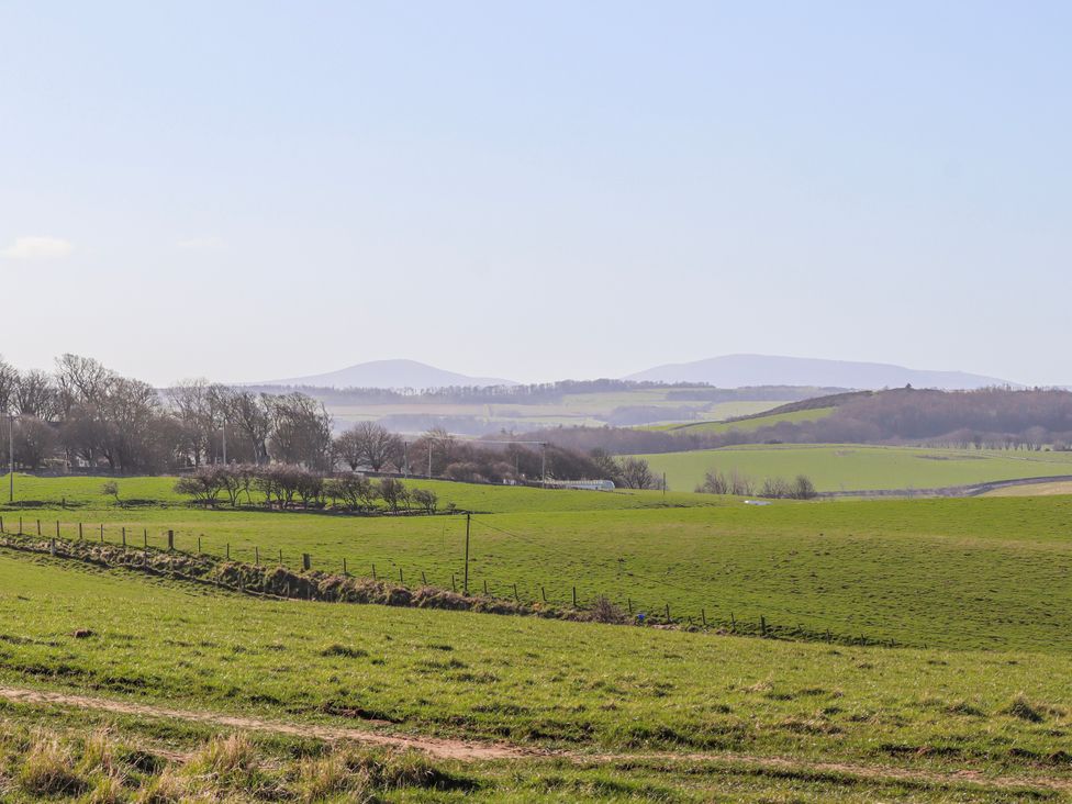 A landscape view of rolling hills and fields at Goosander in Bamburgh