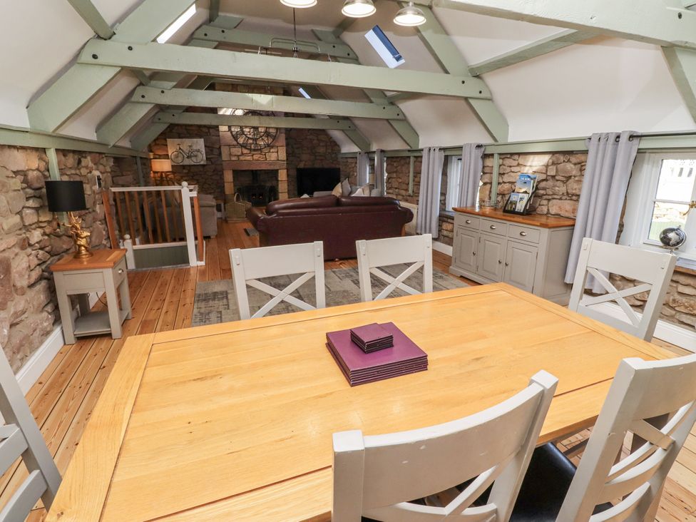 A dining room with a table and chairs at Millstone Lucker