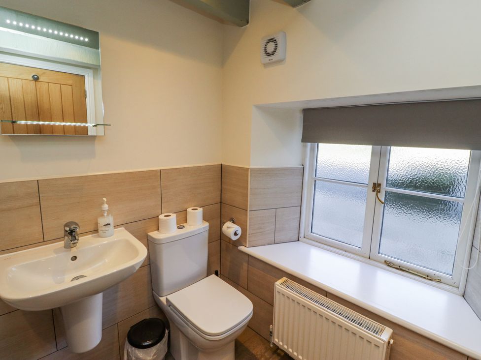 A bathroom with a sink and toilet at Millstone Lucker