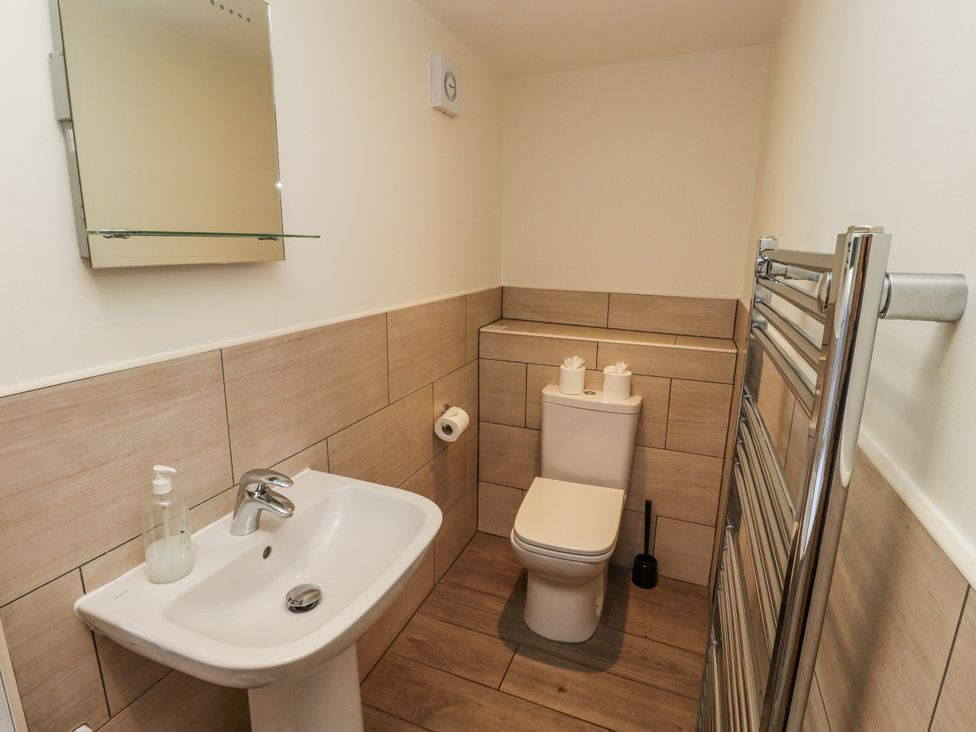 A bathroom with a sink and toilet at Millstone in Lucker