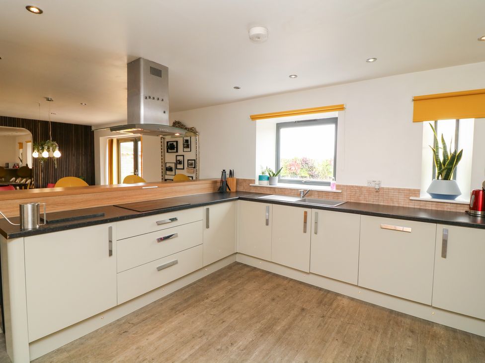 A kitchen with countertop and window at Hayloft in Scampton
