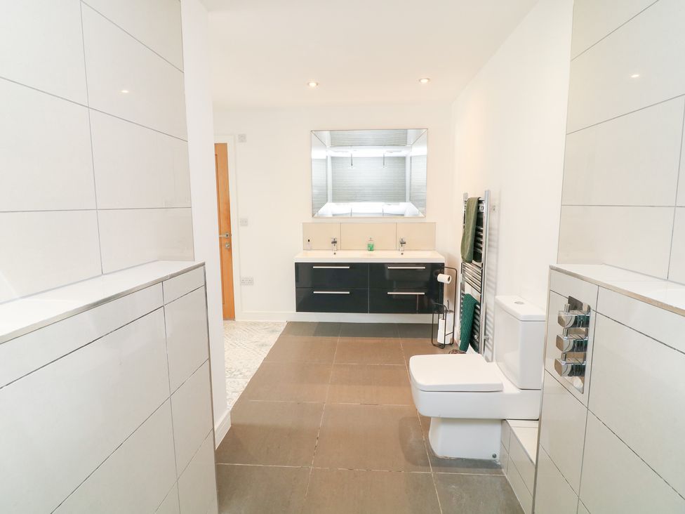 A bathroom with a sink and toilet at Hayloft in Scampton