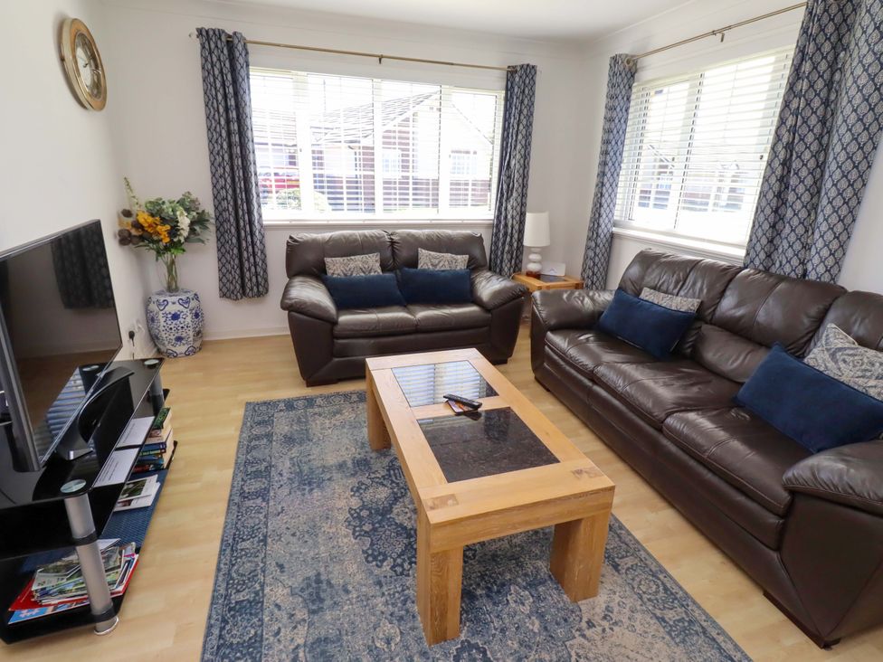 A living room with a sofa and coffee table at 6 Westview in Embleton