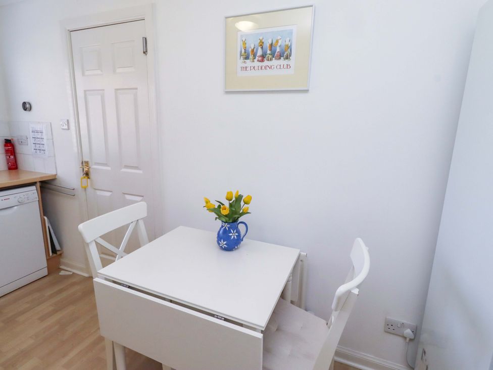 A kitchen with a table and chairs at 6 Westview in Embleton