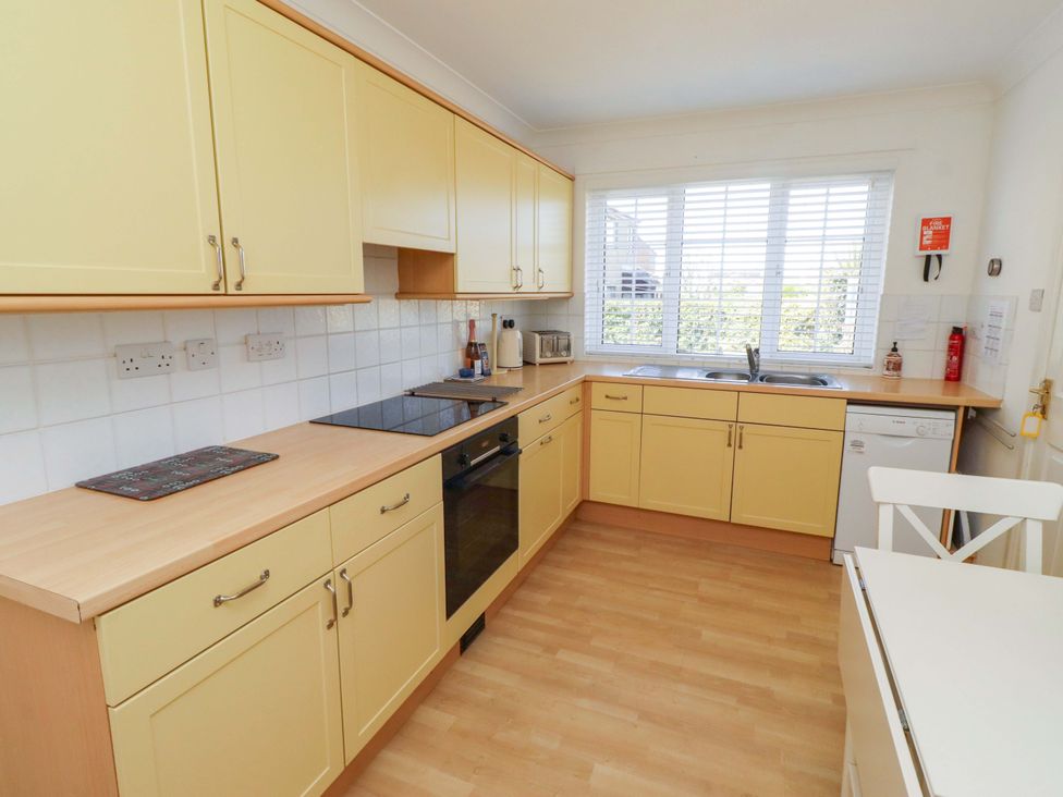 A kitchen with cabinets, sink, and appliances at 6 Westview Embleton