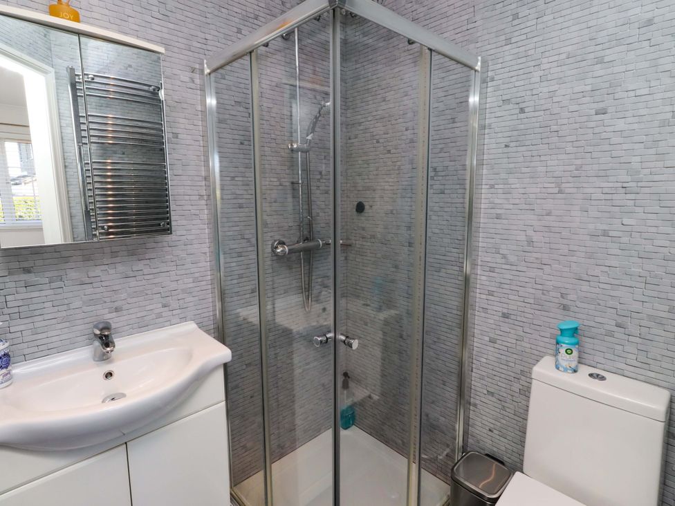 A bathroom with a shower, sink, and toilet at 6 Westview in Embleton