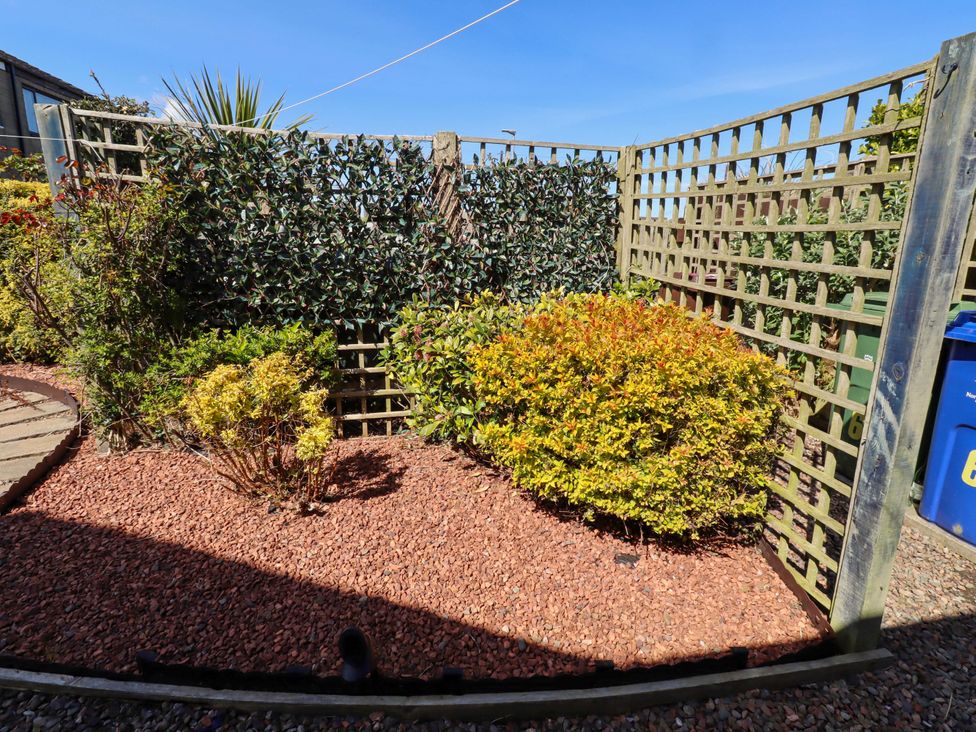 A garden with bushes and a gravel area at 6 Westview Embleton