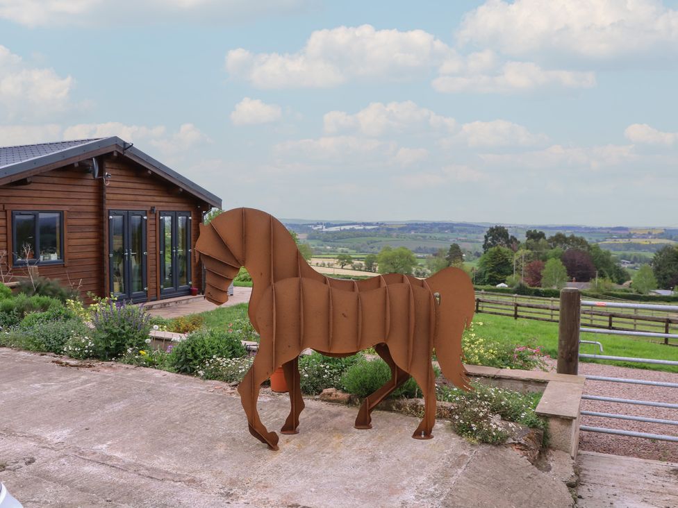 A horse sculpture in a garden outside a house at Palace Farmhouse in St Weonards