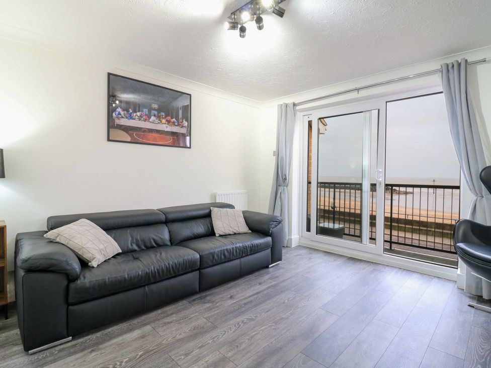 A living room with a sofa and window at 79 Selsey Avenue