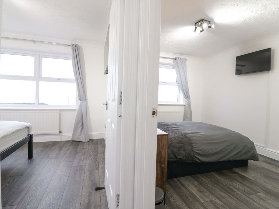 A bedroom with a bed and window at 79 Selsey Avenue