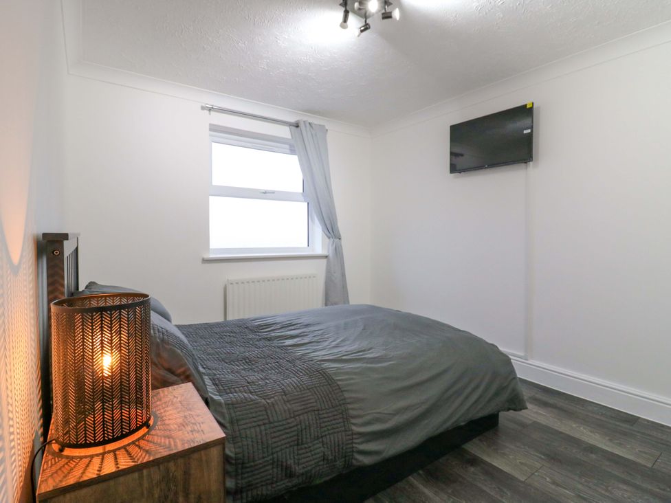 A bedroom with a bed and television at 79 Selsey Avenue