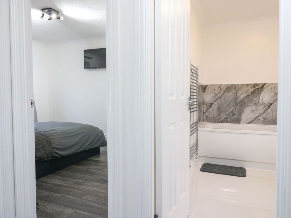 A view into a bedroom with a bed and a television at 79 Selsey Avenue