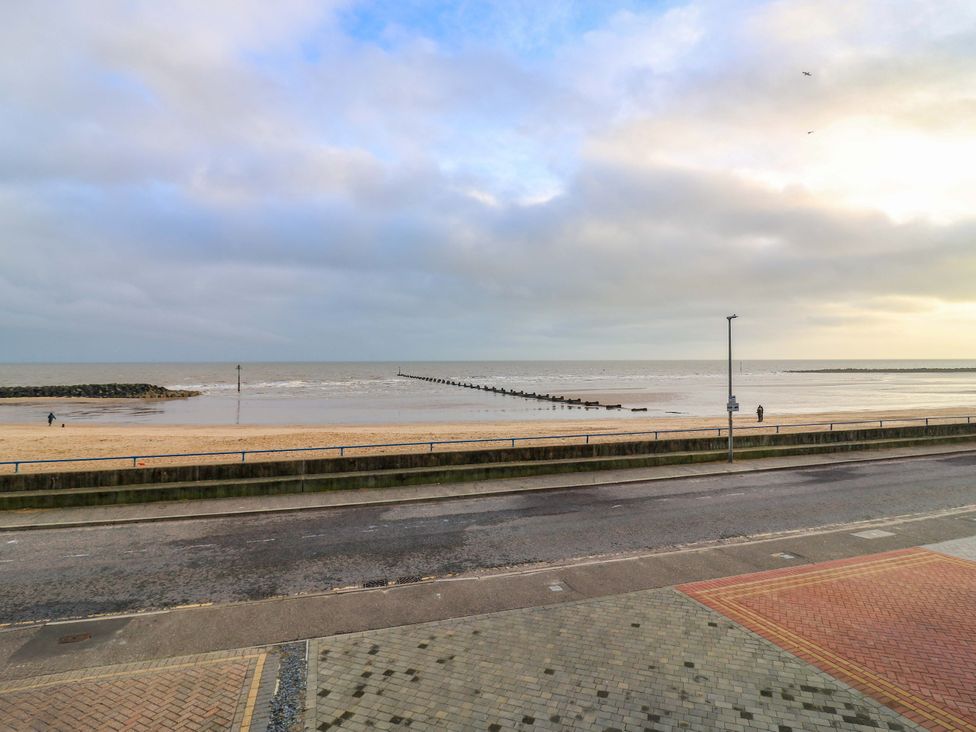 A beach view with a pier and ocean at 79 Selsey Avenue