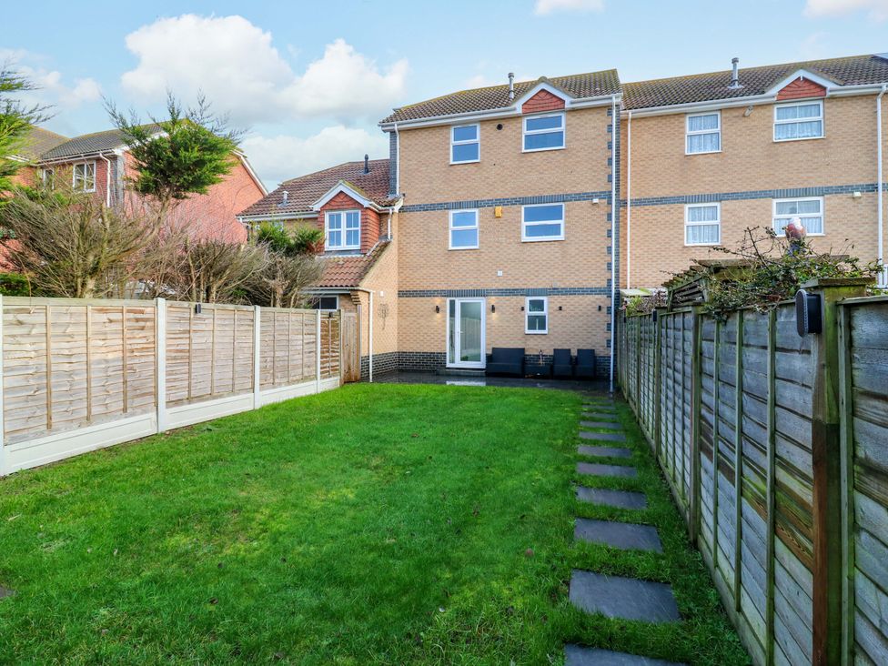 A garden area with grass and a pathway at 79 Selsey Avenue 