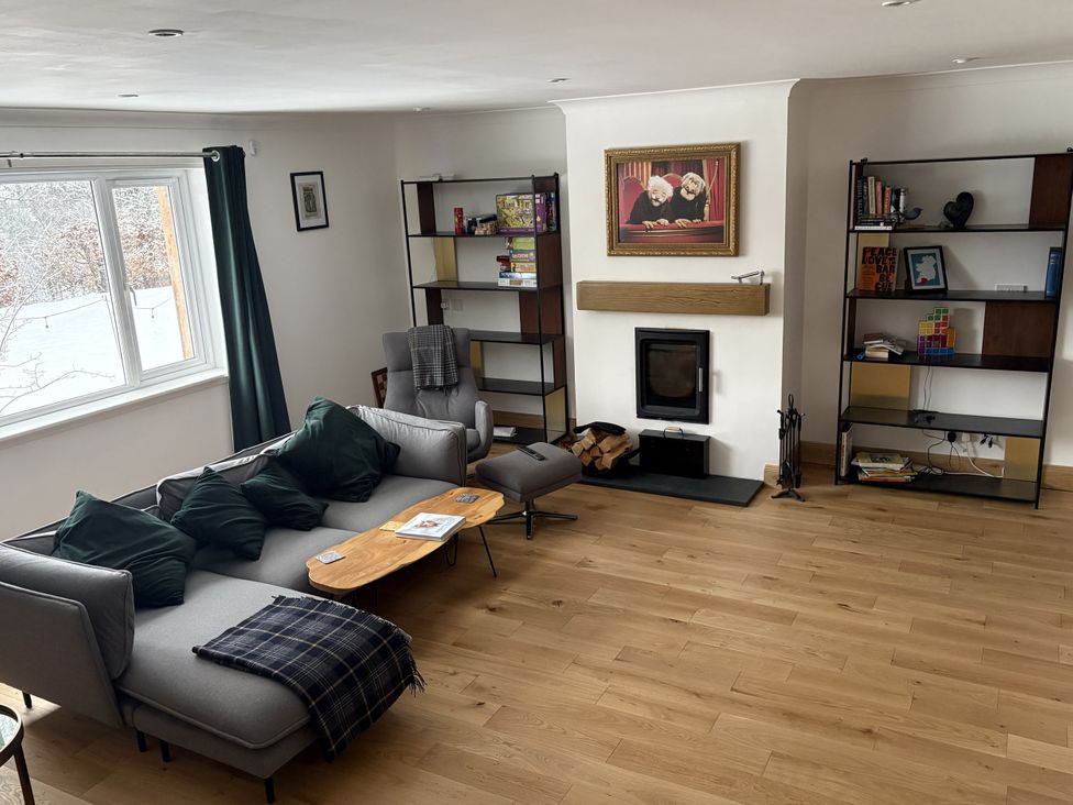 A living room with a sofa and coffee table at Mullingar in Pitlochry