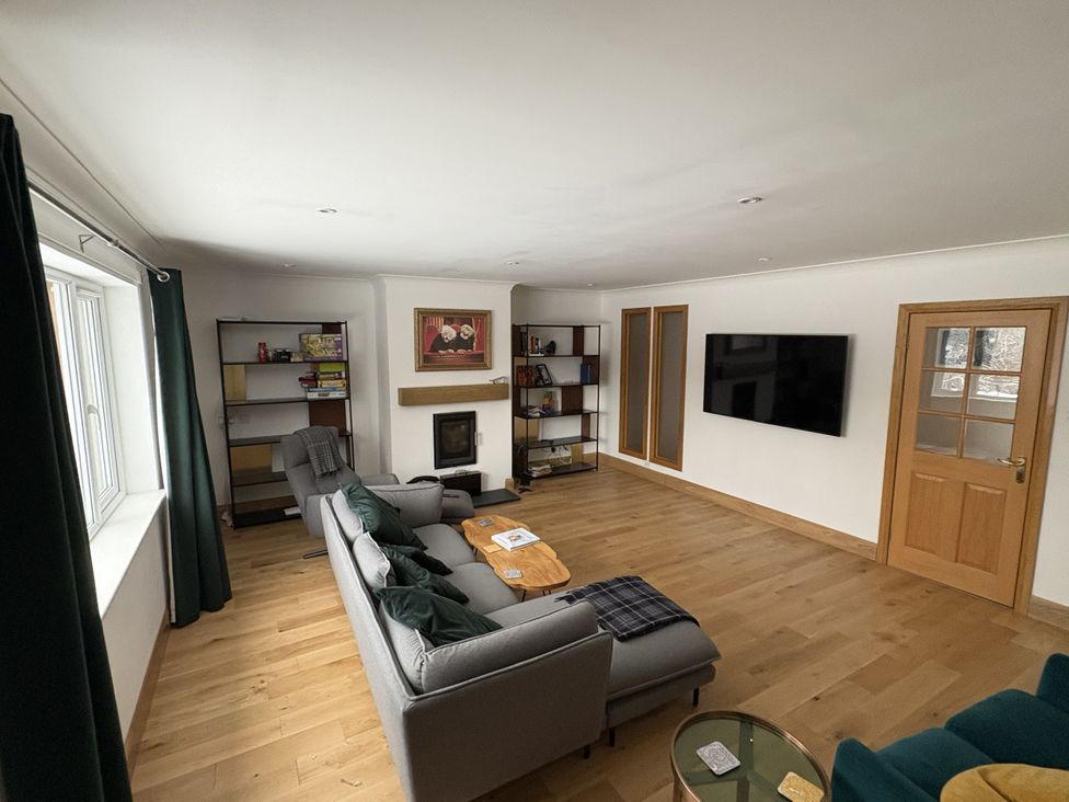 A living room with a sofa and a coffee table at Mullingar in Pitlochry