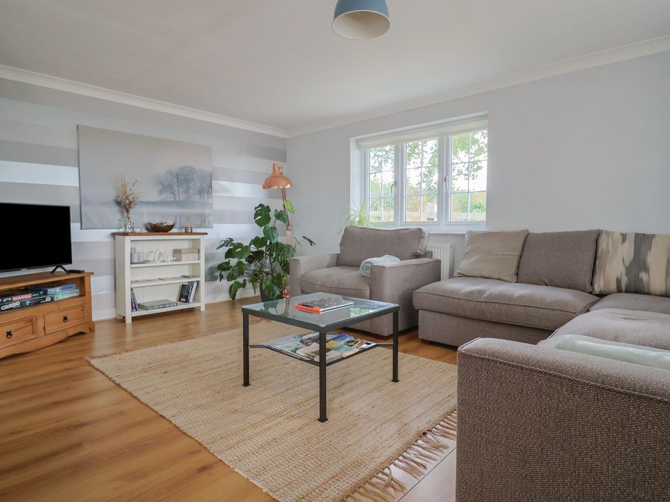 A living room with a sofa and coffee table at Rainbow View Churchstanton near Churchinford