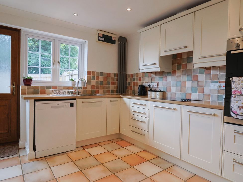 A kitchen with a sink and appliances at Rainbow View Churchstanton near Churchinford