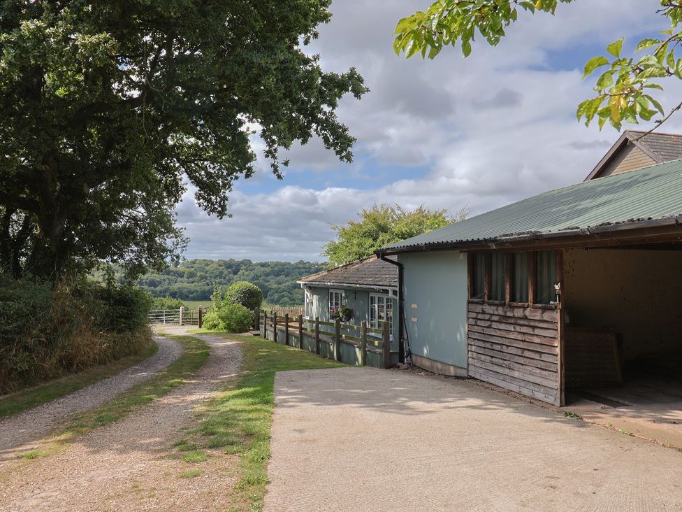 An outdoor area with a driveway leading to a house at Rainbow View in Churchstanton near Churchinford