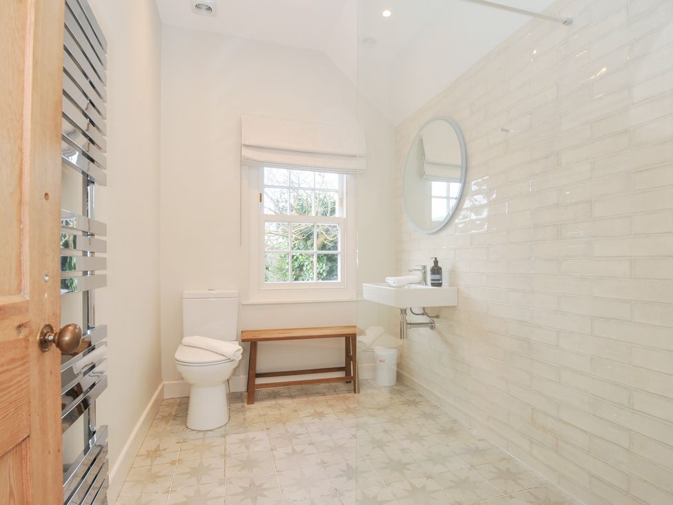 A bathroom with a sink and toilet at Mermaid Cottage in Port Isaac
