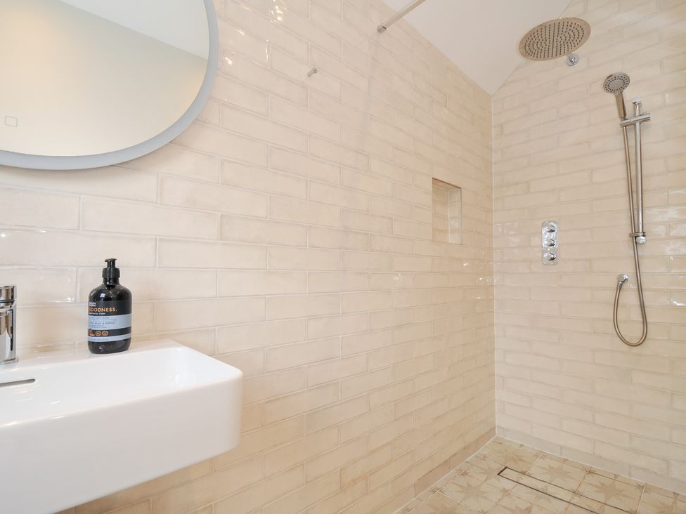 A bathroom with a shower and sink at Mermaid Cottage in Port Isaac