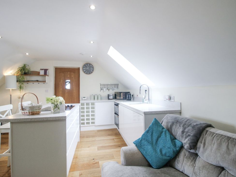 A kitchen with a countertop and appliances at Stable Cottage in Norbury near Bishop's Castle