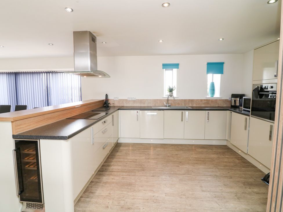 A kitchen with a sink and cabinets at Hideaway in Scampton