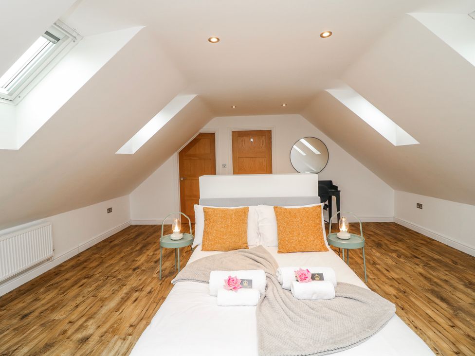 A bedroom with a bed and decor at Lodge 24 South Hykeham