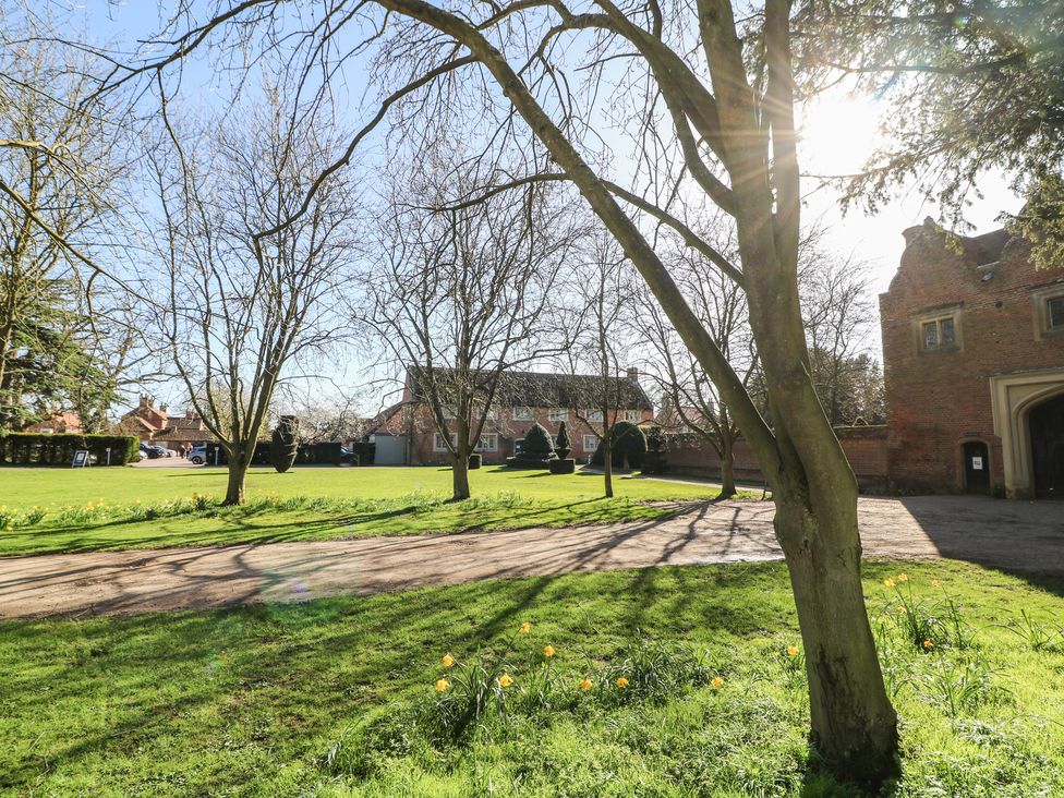 An outdoor area with grass and trees at Lodge 2 South Hykeham