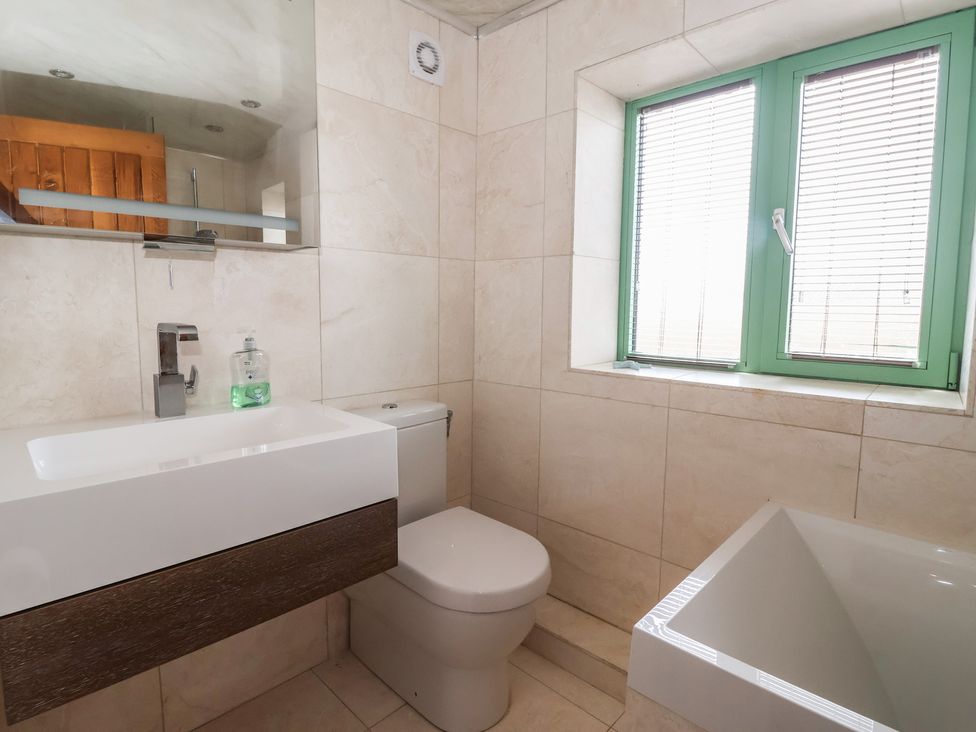 A bathroom with a sink and toilet at 5 Hall Yard in Whitby