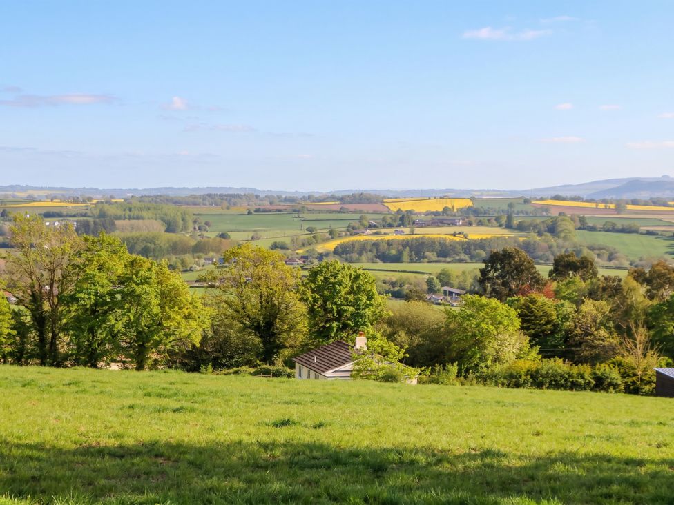A landscape with fields and trees at Palace Bungalow in St Weonards