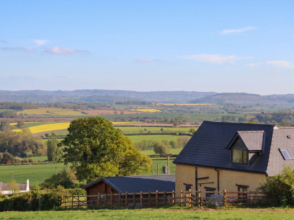 A house with a view of fields and mountains at Palace Studio in St Weonards