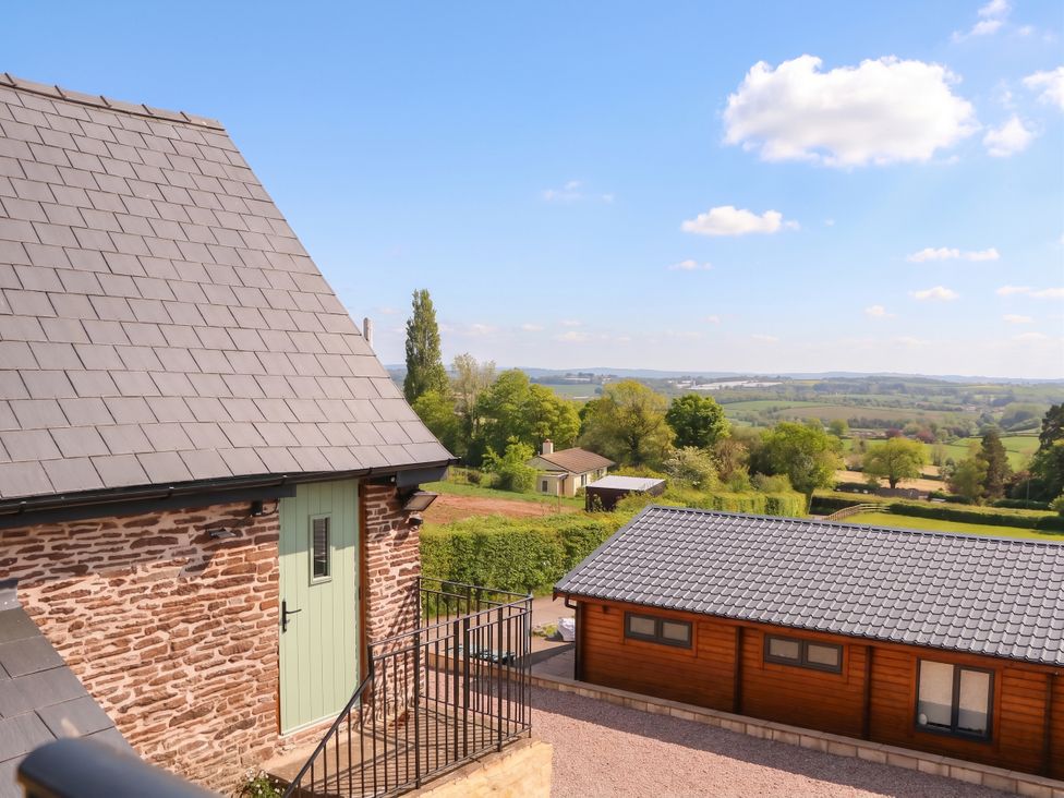 An outdoor view with buildings and trees at Palace Studio St Weonards