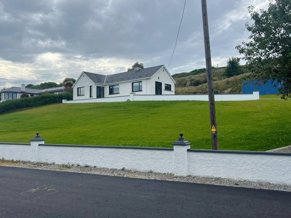 A house on a grassy hill at Rockville in Greencastle, County Donegal