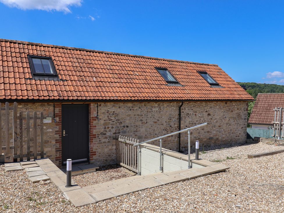 A building with a door and windows at The Stables in Uplyme