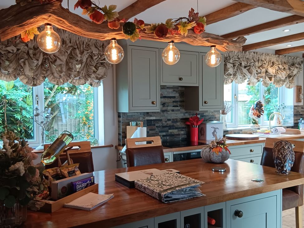 A kitchen with a counter and cabinets at Tawny Owl Cottage North Somercotes