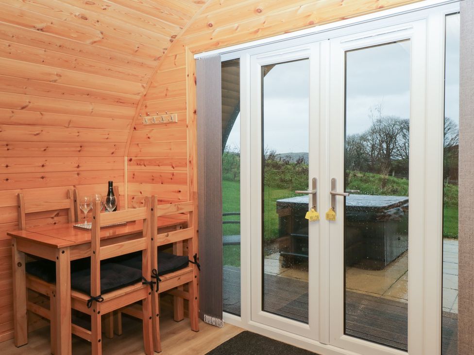 A dining area with table and chairs at Willow in Ulverston