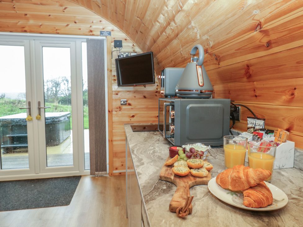A kitchen with microwave and kettle at Willow in Ulverston