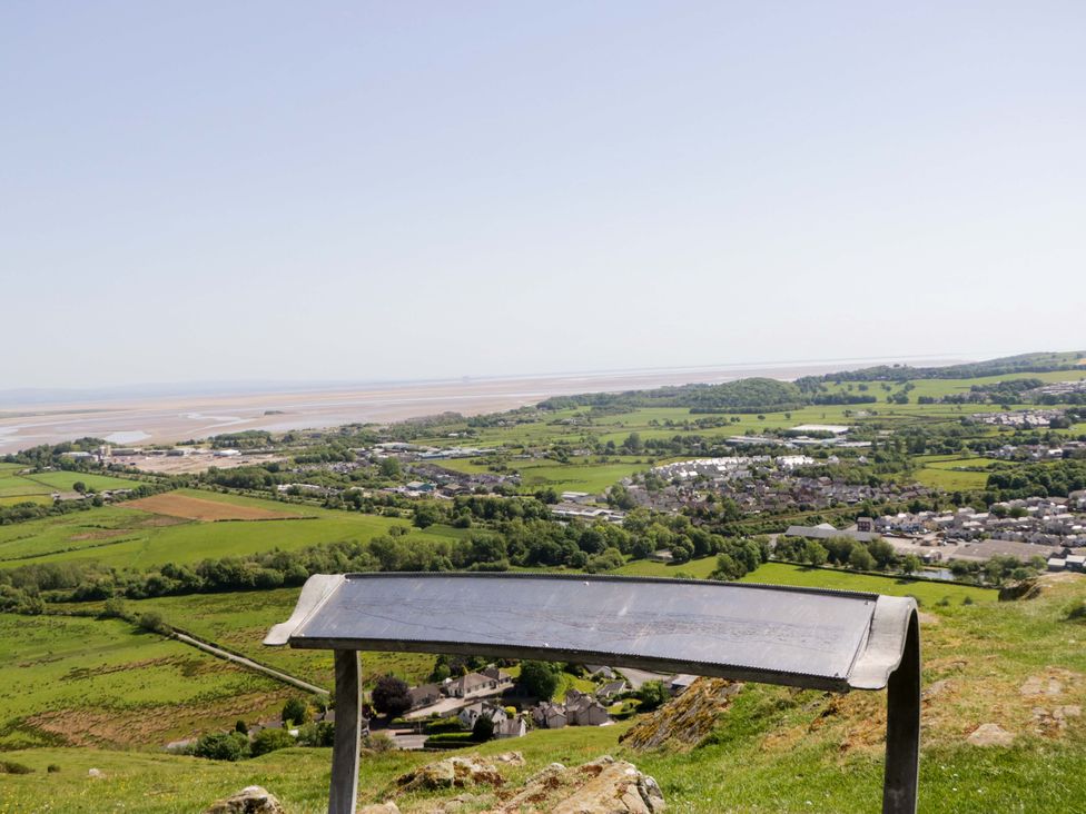 A view overlooking fields and a river from a bench at Willow in Ulverston