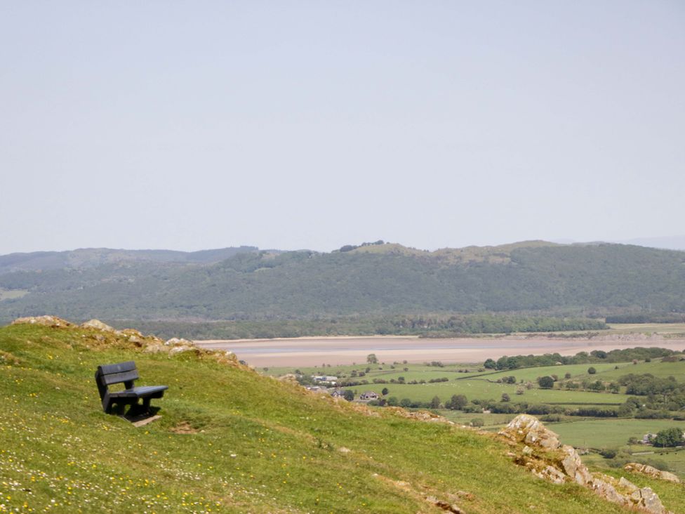 A view of a bench on a hill overlooking a landscape at Willow in Ulverston