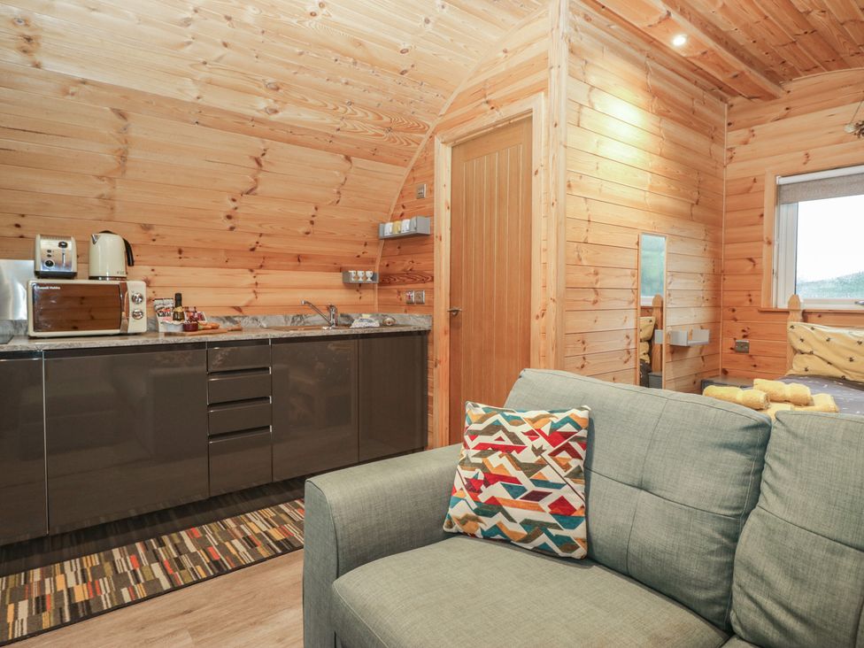 A kitchenette with a sofa and appliances at Oak in Ulverston