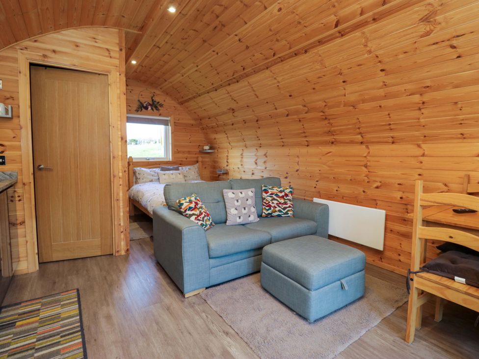 A living room with a sofa and bed at Cherry in Ulverston