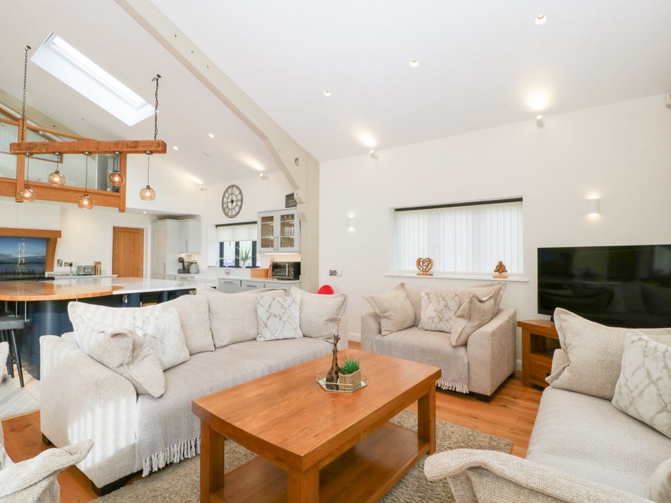 A living room with a coffee table and sofa at Bilsham Meadows in Aust