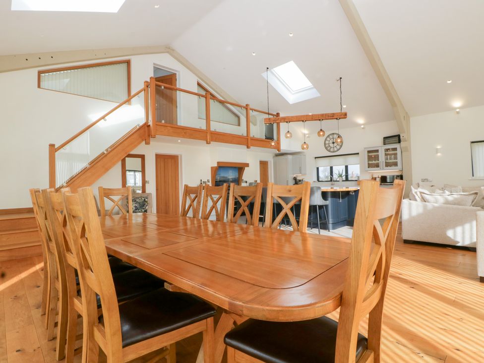 A dining room with a large table and chairs at Bilsham Meadows in Aust